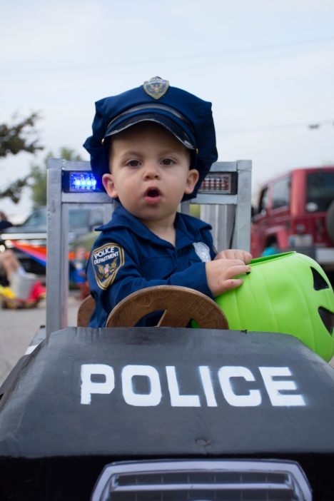 Jace Williams, 2 of Guthrie, looks out from his homemade police car at Waterloo Road Baptist Church's Fall Frolic.