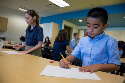 Salvador Trejo, a fourth-grader draws during his second day class at John Rex Elementary